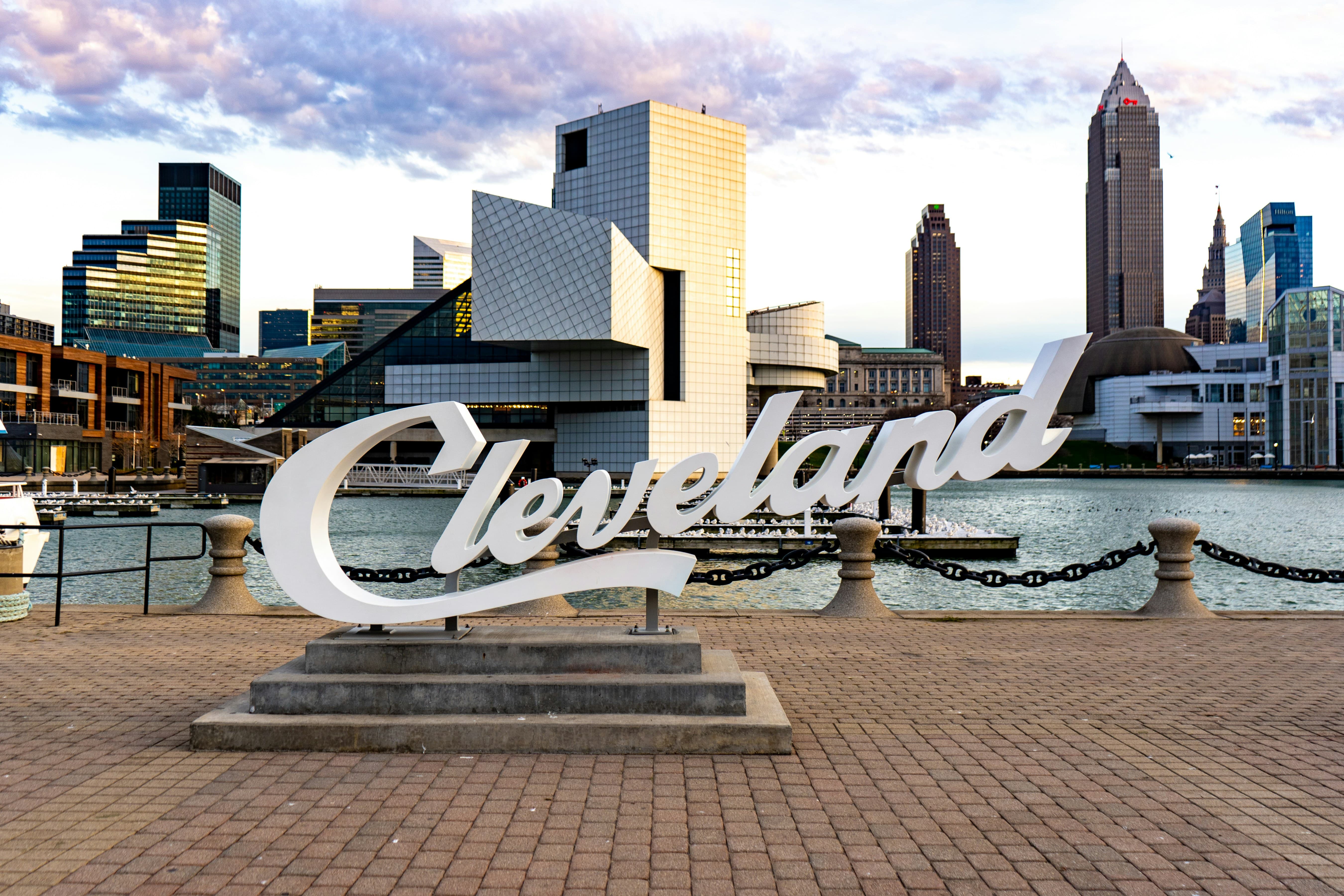 Cleveland skyline from the waterfront with the Cleveland script sign in the foreground